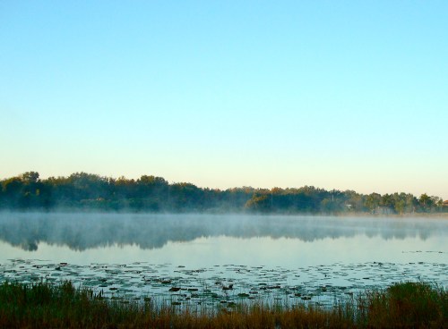 Plumes of steam fog dance across the lake.